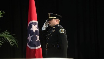 Officer Salute with Tennessee Flag in Background