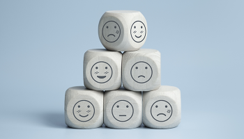 6 dice with a variety of faces drawn on them in a pyramid configuration