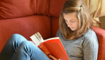Teenage girl reading a book