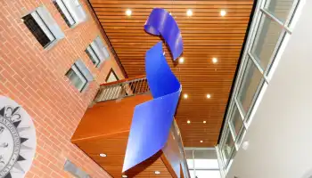 Interior of Madison Precinct looking up at ceiling and decorative blue ribbon sculpture