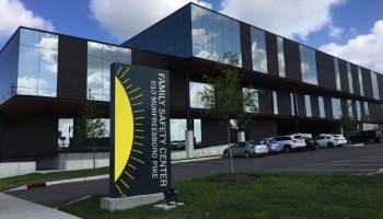 Front of Police Headquarters building and sign seen from left corner