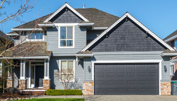 Two-story house with garage in neighborhood