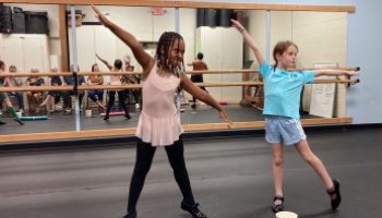 two girls tap dancing
