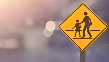 school crossing sign on a blurred background