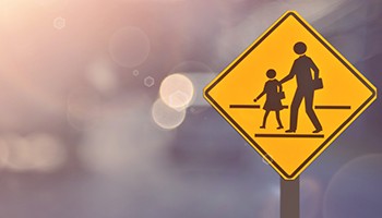 school crossing sign on a blurred background