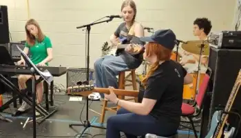 learning to play in a band.