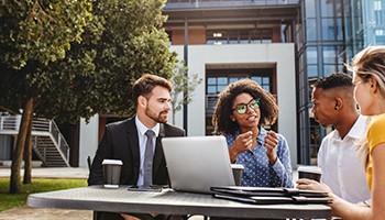 PHOTO: group of people talking outdoors