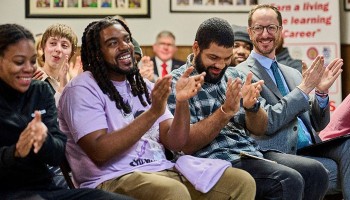 group of people including Mayor Freddie O'Connell clapping