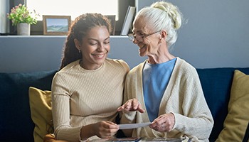 Decorative: image of elderly woman conversing with young lady