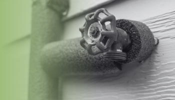 a water spigot attached to a house