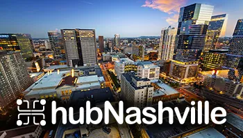 Elevated view of Nashville skyline at dusk with illuminated buildings and hubNashville logo overlay.