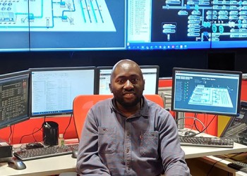 F Adom energy manager at computer