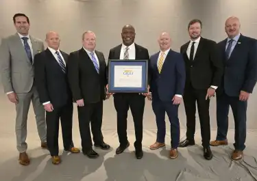 MNPD receives Advanced Law Enforcement Reaccreditation with Excellence.  (L-R) CALEA President Matthew Packard, Colonel, Colorado State Patrol, MNPD Lieutenant Jason Sharpe, MNPD Sergeant Michael Park, Chief Drake, MNPD Accreditation Manager Lieutenant Matt Howlett, MNPD Sergeant Danny Cole, CALEA Executive Director W. Craig Hartley, Jr.