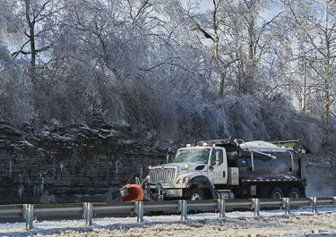 Snow plow in winter landscape
