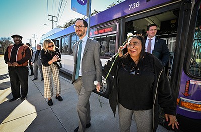 Mayor exiting a city bus