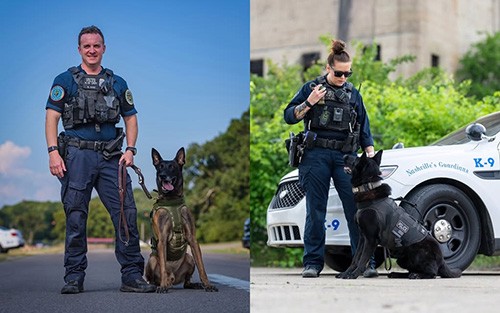 Two Officers Standing with their Canines