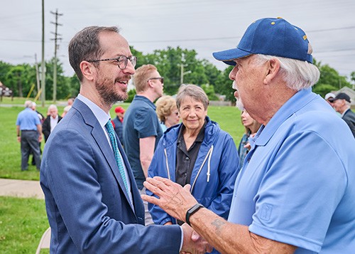 The mayor of Nashville shaking hands with a constituent