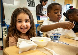 young children eating meal