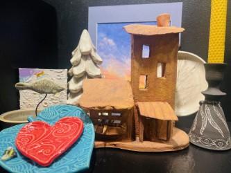 A collection of artwork, ceramic pieces and paintings
