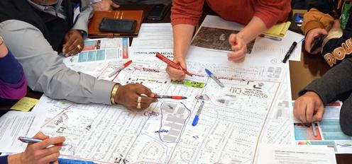 Photo of people reviewing building plans