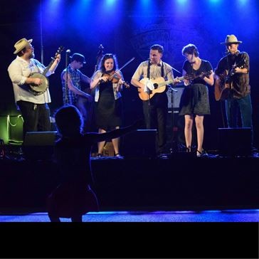 photo of musicians performing on a stage