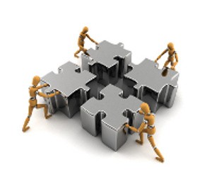 People Pushing a Puzzle Together