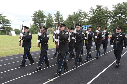 Metro Police riflemen marching in formation