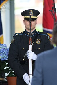 Metro Police rifleman standing at attention with rifle