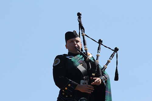 Metro Police lone bagpiper playing