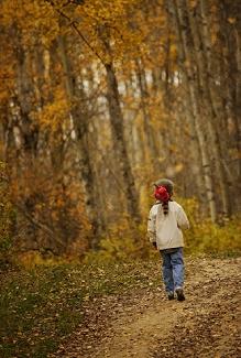 Girl Running Away Into a Forest