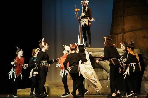 kids on stage during a performance