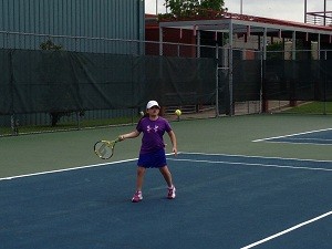 Tournament photo girl hitting ball