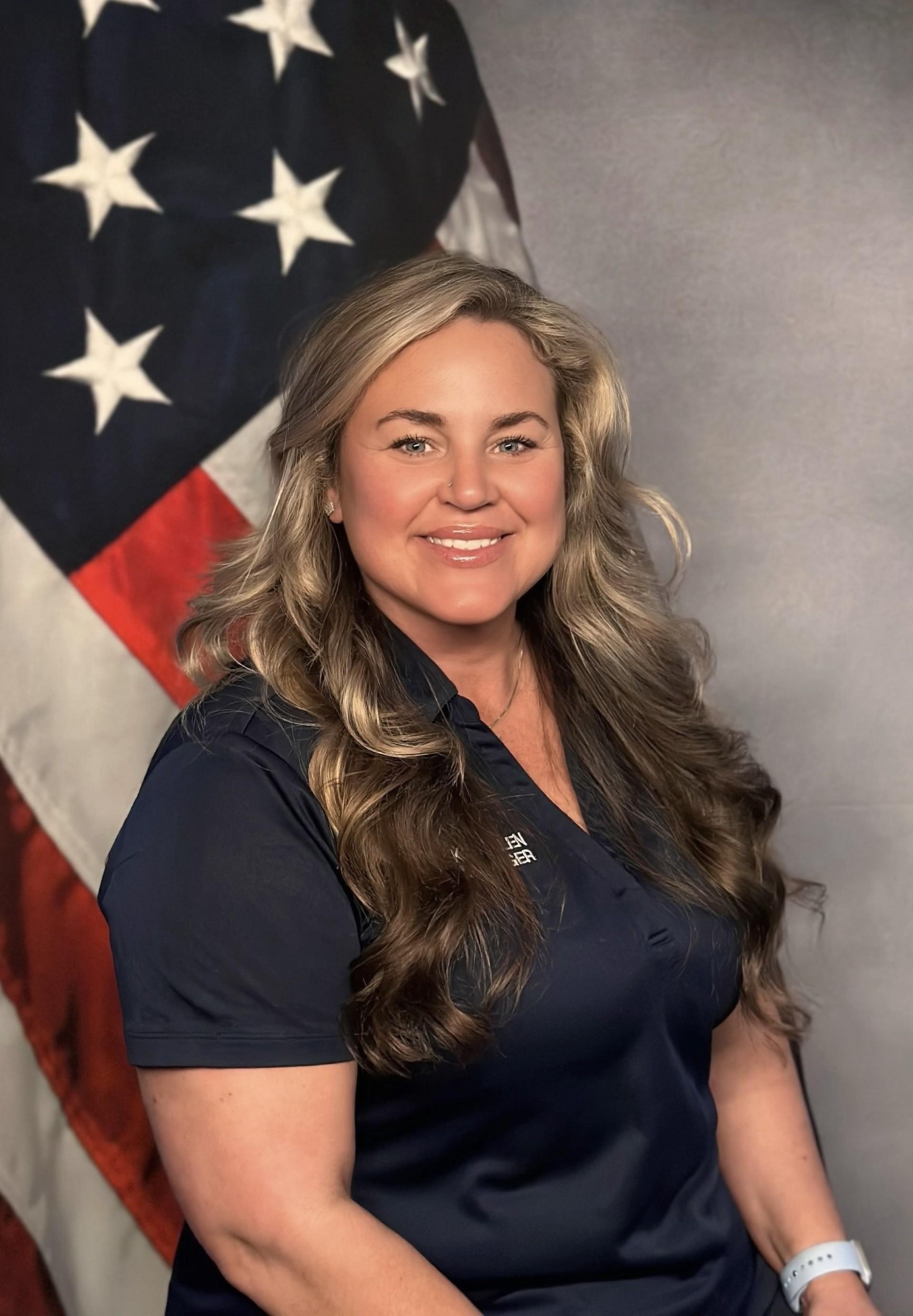 woman in front of flag