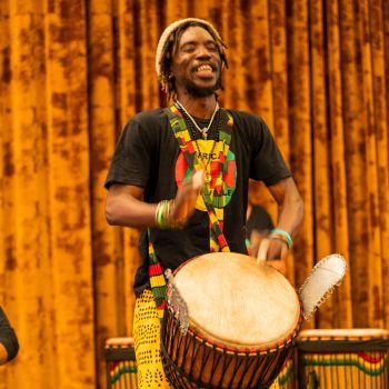 Ibros playing the Djembe Drum