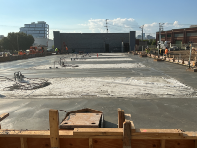 Four wet slabs of concrete in the afternoon sun
