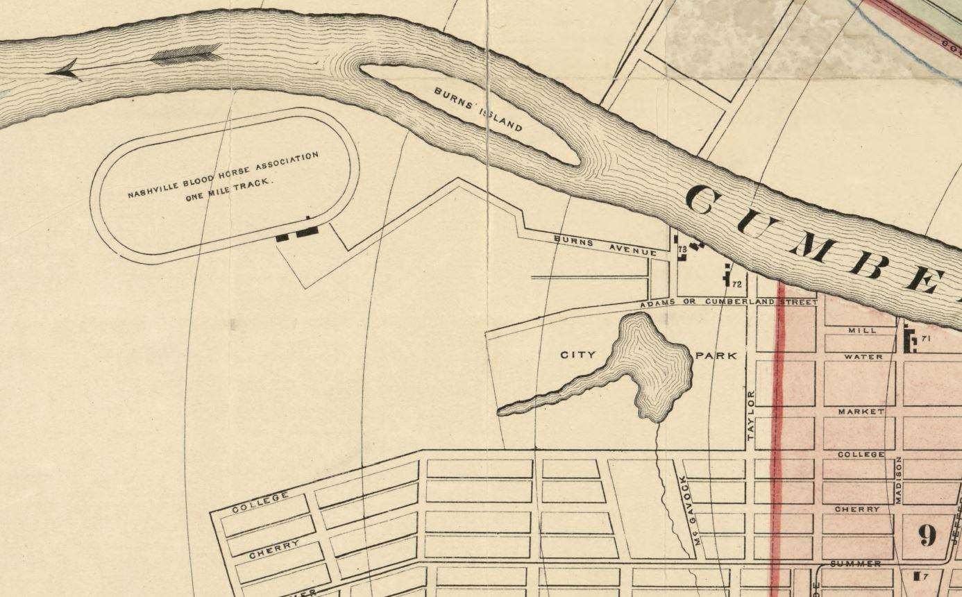 Historical map detail showing curved streets and building layouts with handwritten annotations in sepia tones.