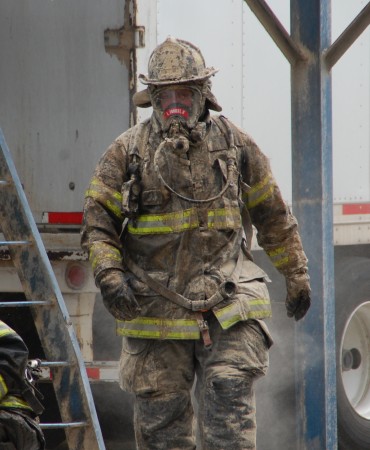 firefighter's uniform covered in soot