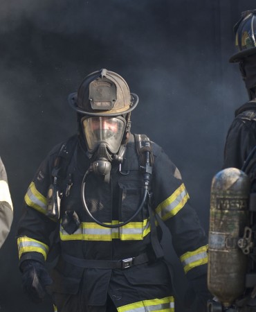 firefighters exiting smoky building