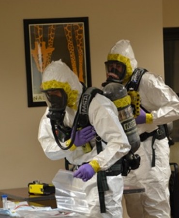 firefighters in HAZMAT suits