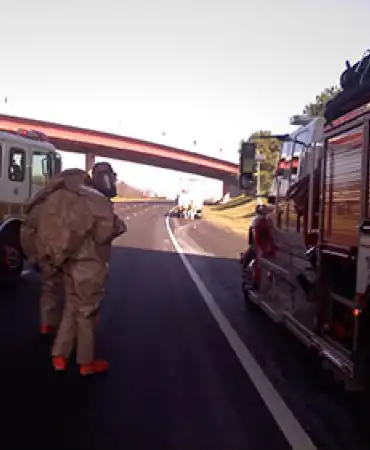 Hazardous Materials team on road next to fire trucks