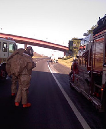 Hazardous Materials team on road next to fire trucks
