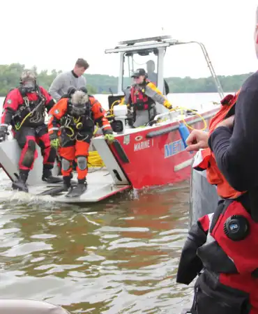 ESU staff exiting watercraft