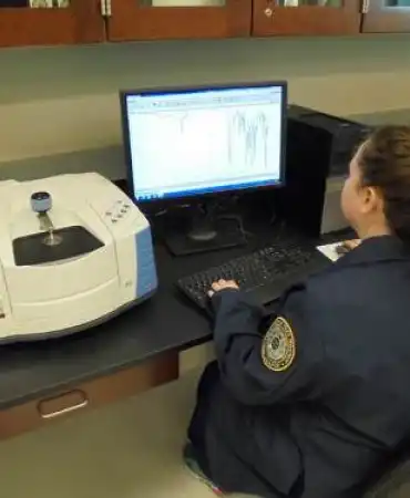 Scientist reviewing FTIR data