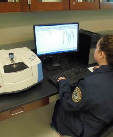 Scientist reviewing FTIR data