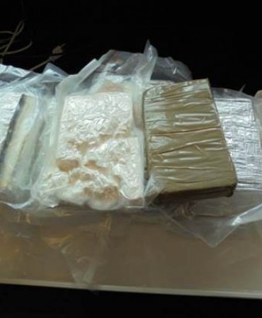 Evidence submission of compressed solid material (kilos of Cocaine)