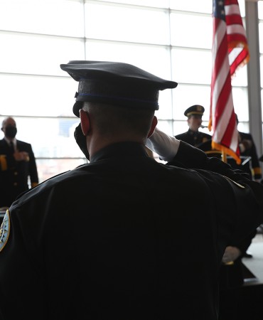 Police Academy officers saluting