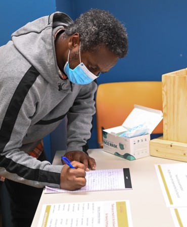 Person voting at Participatory Budget Voting Expo