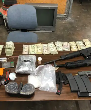 Seized guns, drugs, cash