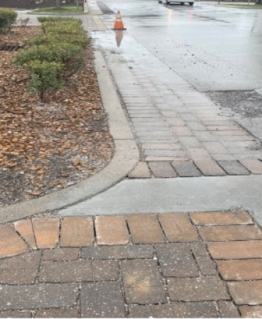 Repaired pavers (in foreground) let the rainwater filter through