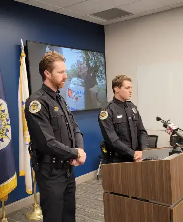 Officers Perry and Hodges at news conference 